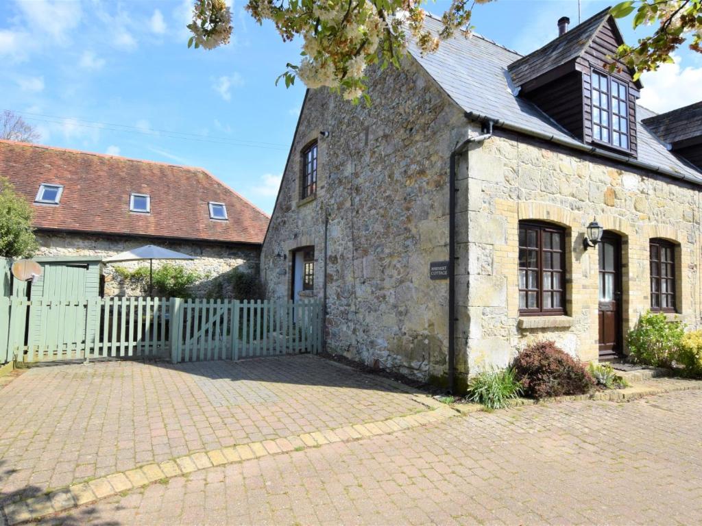 an old stone building with a white fence at 2 bed property in Shanklin Isle of Wight IC059 in Shanklin