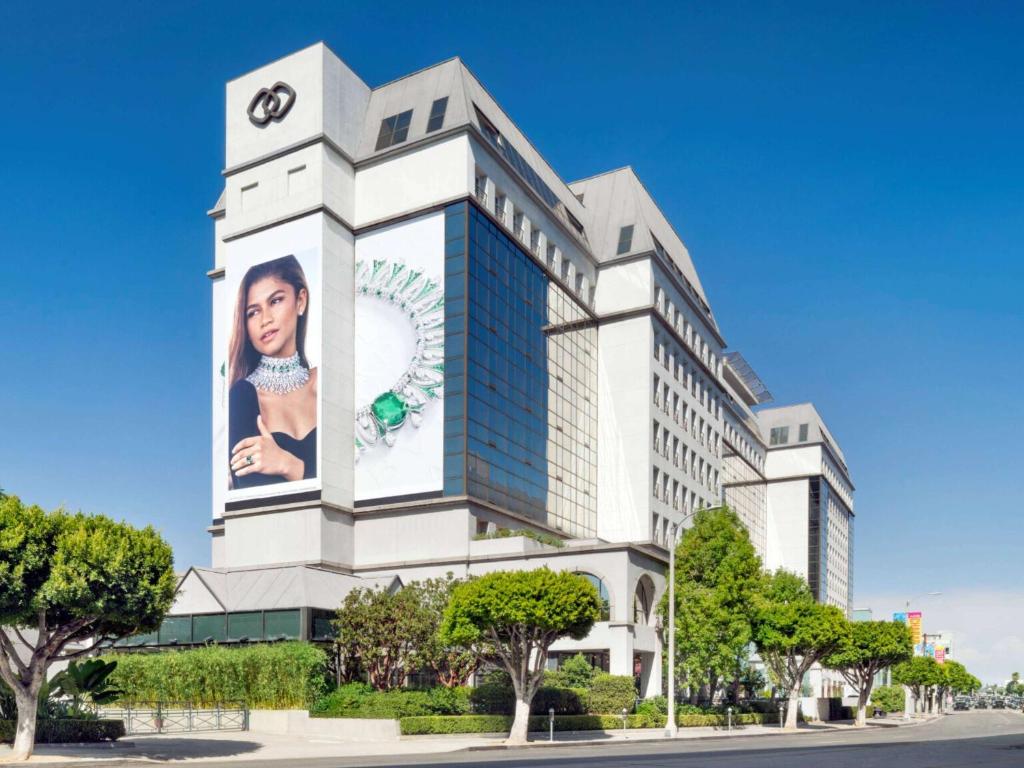 a building with an advertisement on the side of it at Hotel Sofitel Los Angeles at Beverly Hills in Los Angeles