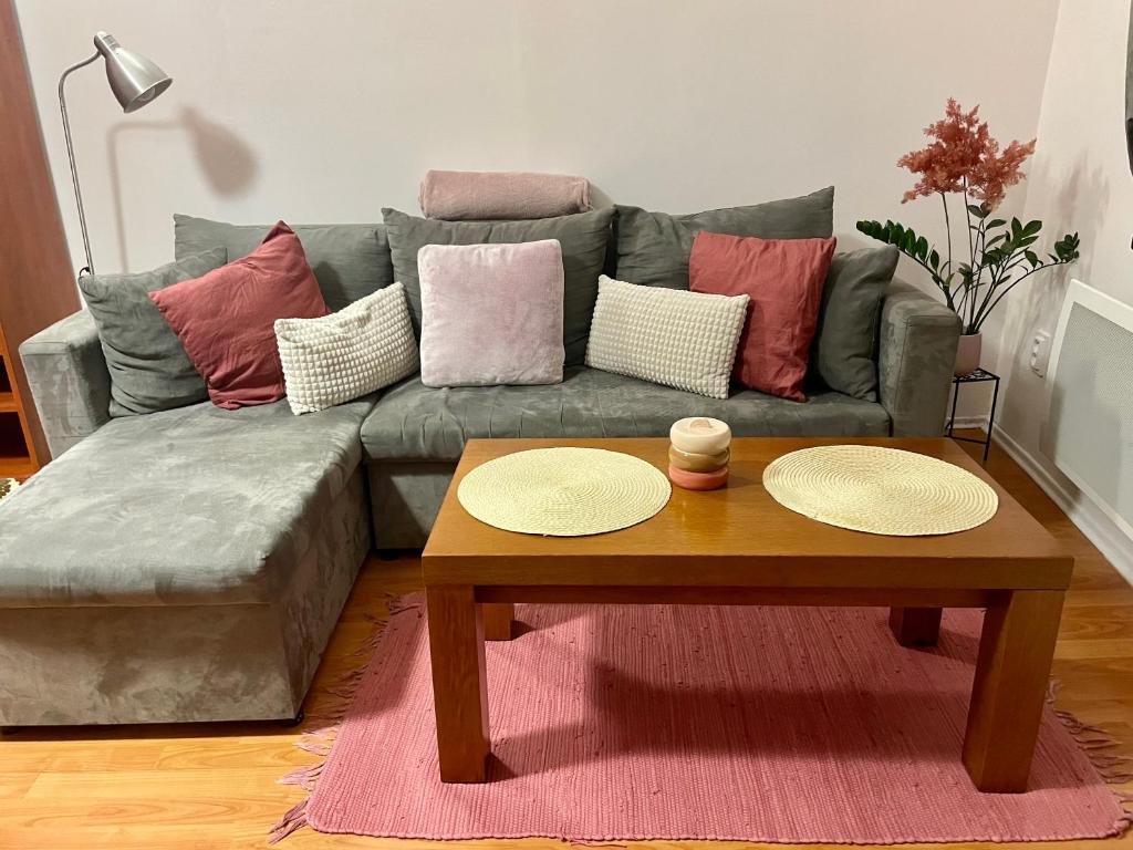a living room with a couch and a coffee table at Apartment Ela Centre in Košice