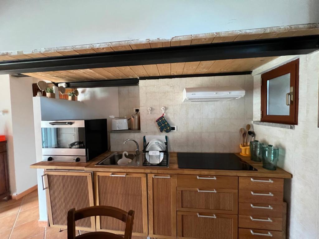 Kuchyň nebo kuchyňský kout v ubytování Hotel Villalago trasimeno