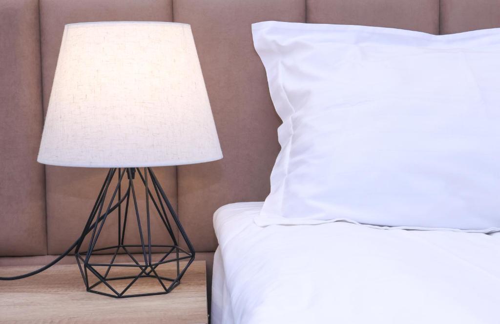 Postel nebo postele na pokoji v ubytování MANDARIN Hotel