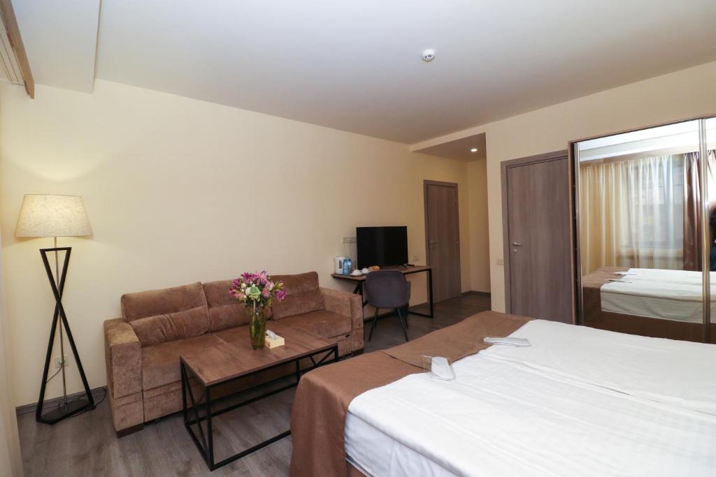 Postel nebo postele na pokoji v ubytování MANDARIN Hotel