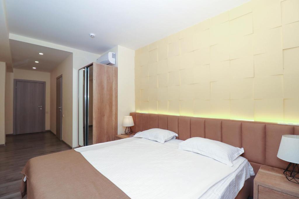 Postel nebo postele na pokoji v ubytování MANDARIN Hotel
