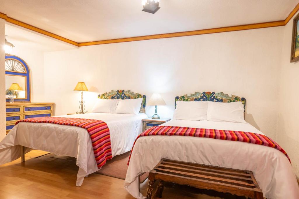 Postel nebo postele na pokoji v ubytování Hotel Rincon de Josefa