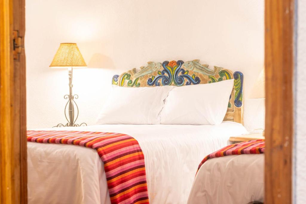 Postel nebo postele na pokoji v ubytování Hotel Rincon de Josefa