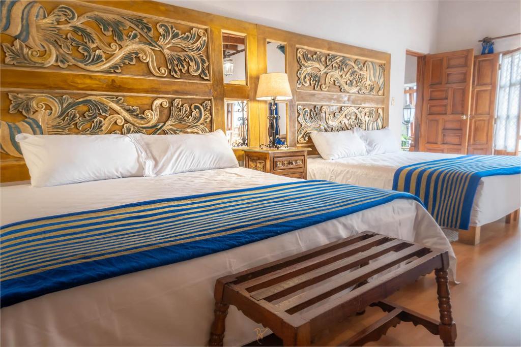 Postel nebo postele na pokoji v ubytování Hotel Rincon de Josefa
