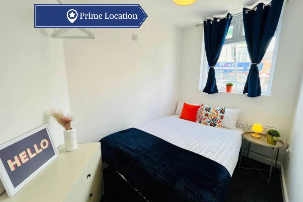 a small bedroom with a bed and a window at Boutique 1Bed Apt Near the City Centre in Liverpool