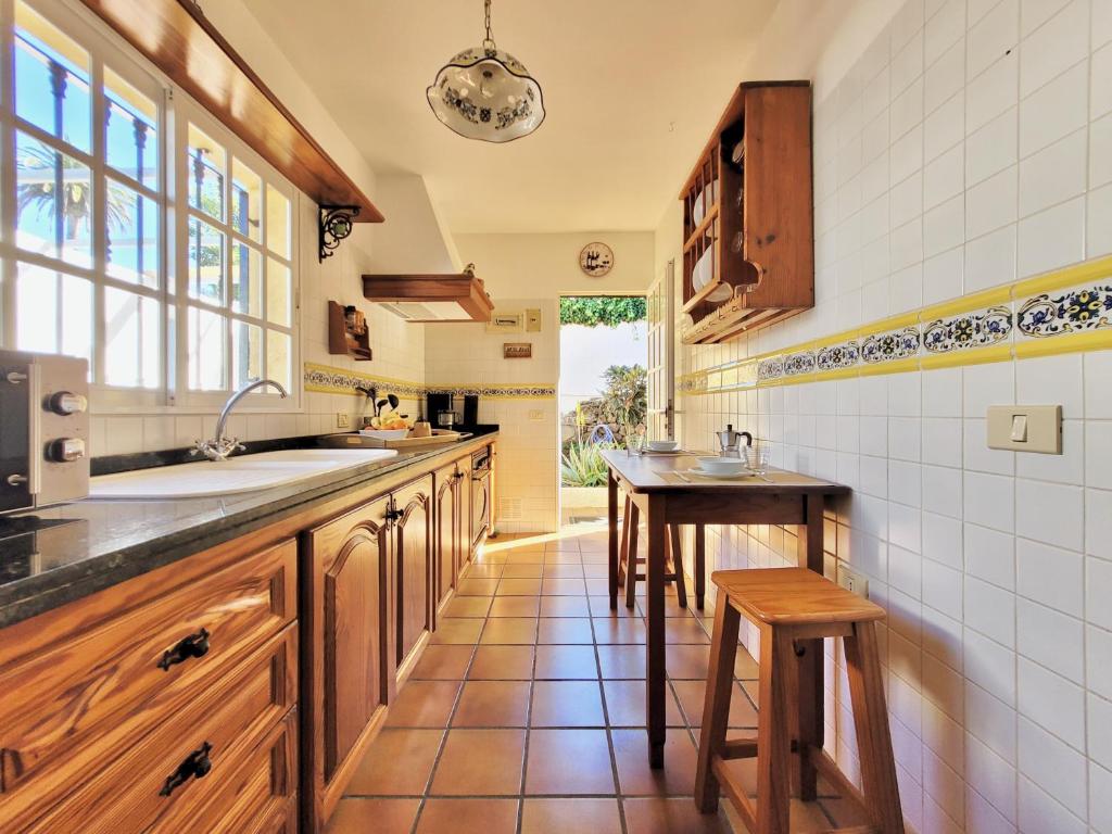 Kuchyňa alebo kuchynka v ubytovaní Villa Flores y Sol