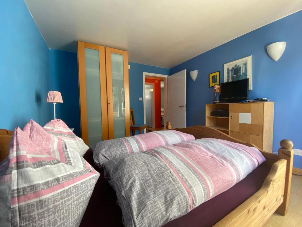 Postel nebo postele na pokoji v ubytování Ferienwohnung Sotcha 8c