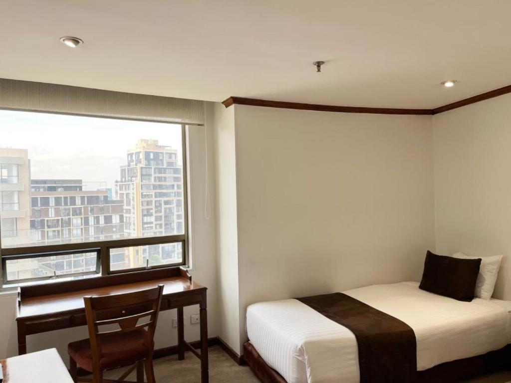 Postel nebo postele na pokoji v ubytování Hotel Bogotá Regency Usaquén
