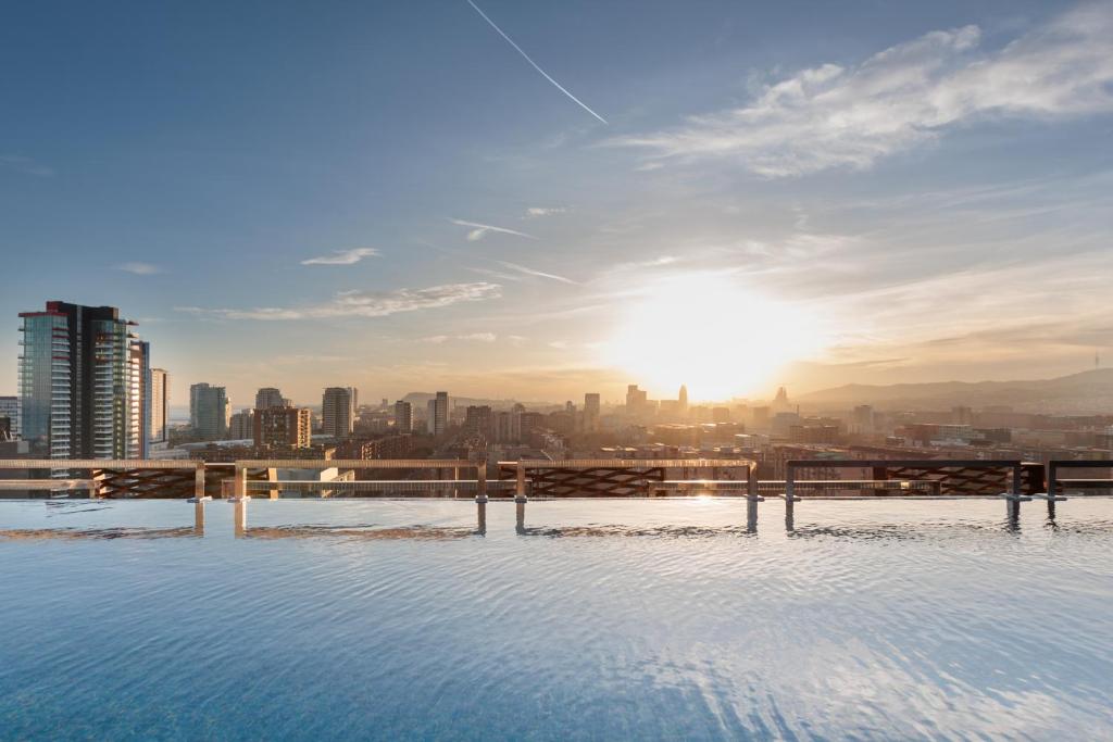 a swimming pool with a view of a city at Tembo Barcelona in Barcelona