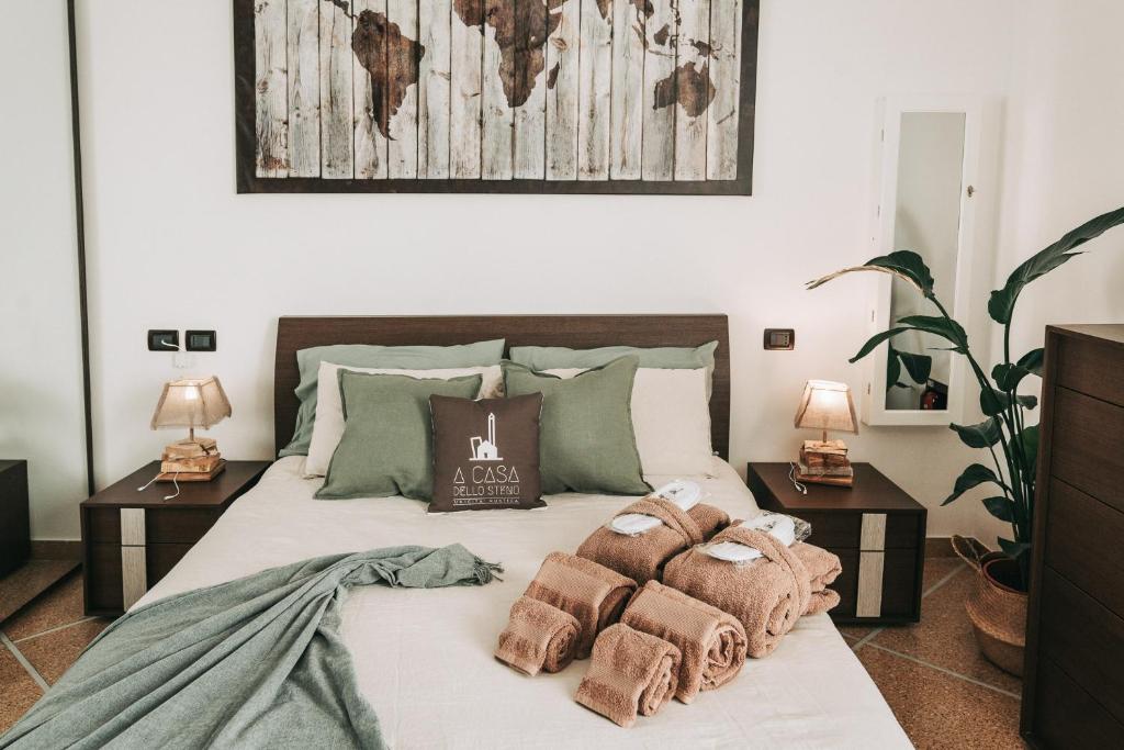 a bedroom with a bed with pillows on it at A Casa dello Steno - Unicità Rustica in Bologna