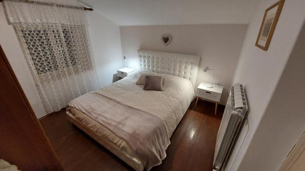 Postel nebo postele na pokoji v ubytování Vila Stančič