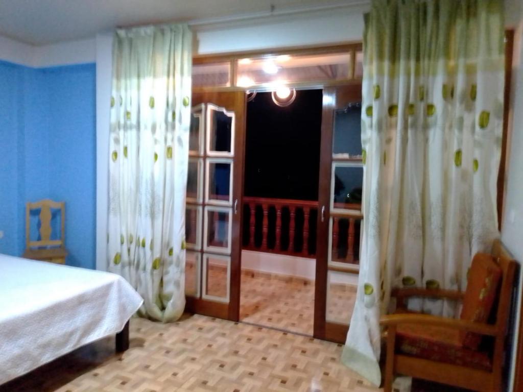 Ένα ή περισσότερα κρεβάτια σε δωμάτιο στο HOSPEDAJE LUCIANA´S - OXAPAMPA