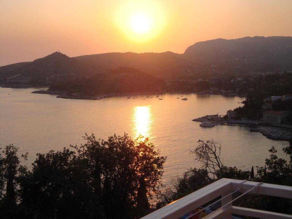 a view of a body of water at sunset at Villa Barbara in Mlini