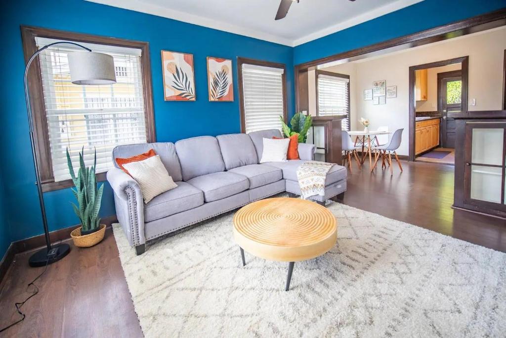 a living room with a couch and a table at Sunny Retreat near San Diego Zoo, Beach & Downtown in San Diego