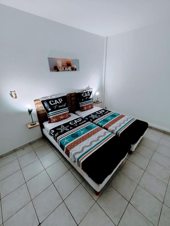 Postel nebo postele na pokoji v ubytování Le Nil Appartement Cosy tout confort
