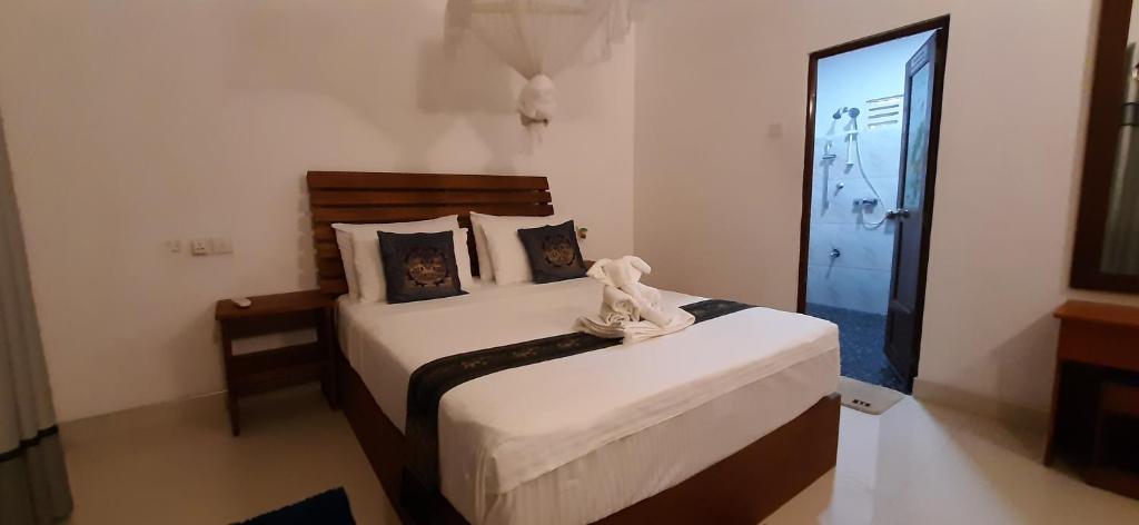 Postel nebo postele na pokoji v ubytování The Otunna Guest House Sigiriya