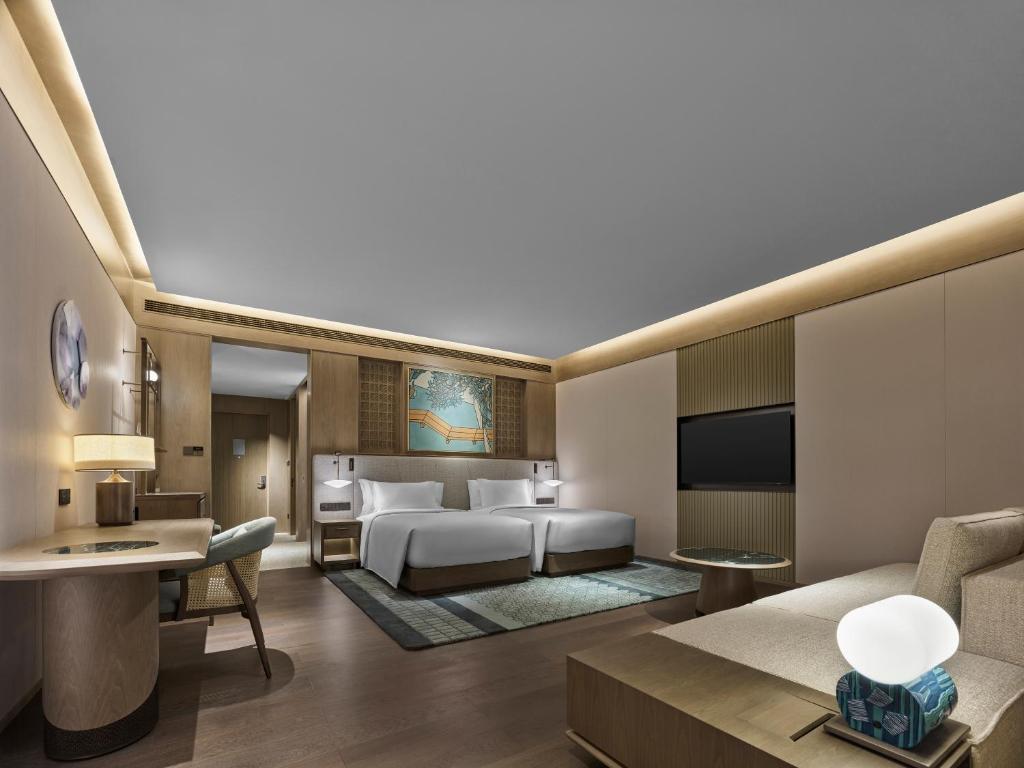 Postel nebo postele na pokoji v ubytování Banyan Tree Suzhou Shishan
