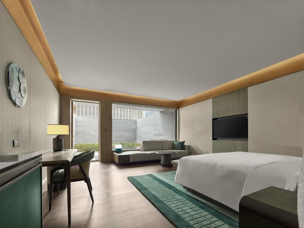 Postel nebo postele na pokoji v ubytování Banyan Tree Suzhou Shishan