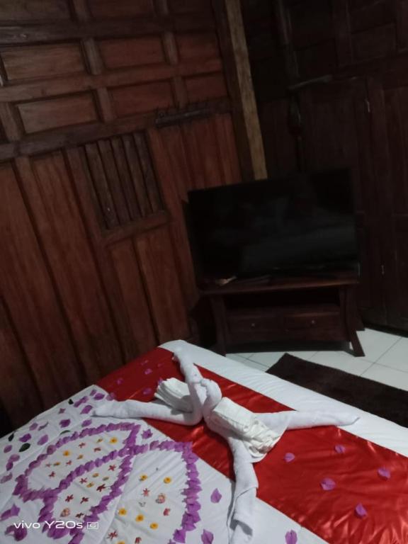Una cama o camas en una habitación de Villa Mak Cik