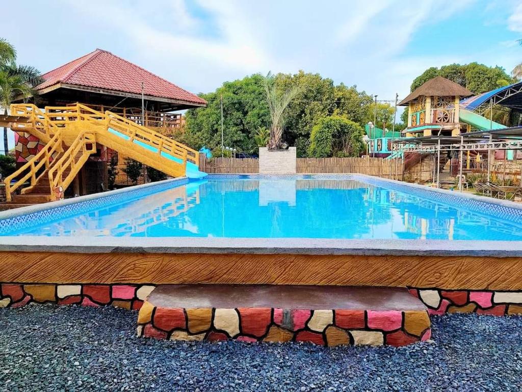 a swimming pool at a theme park at Arzel Resort in Mangatarem