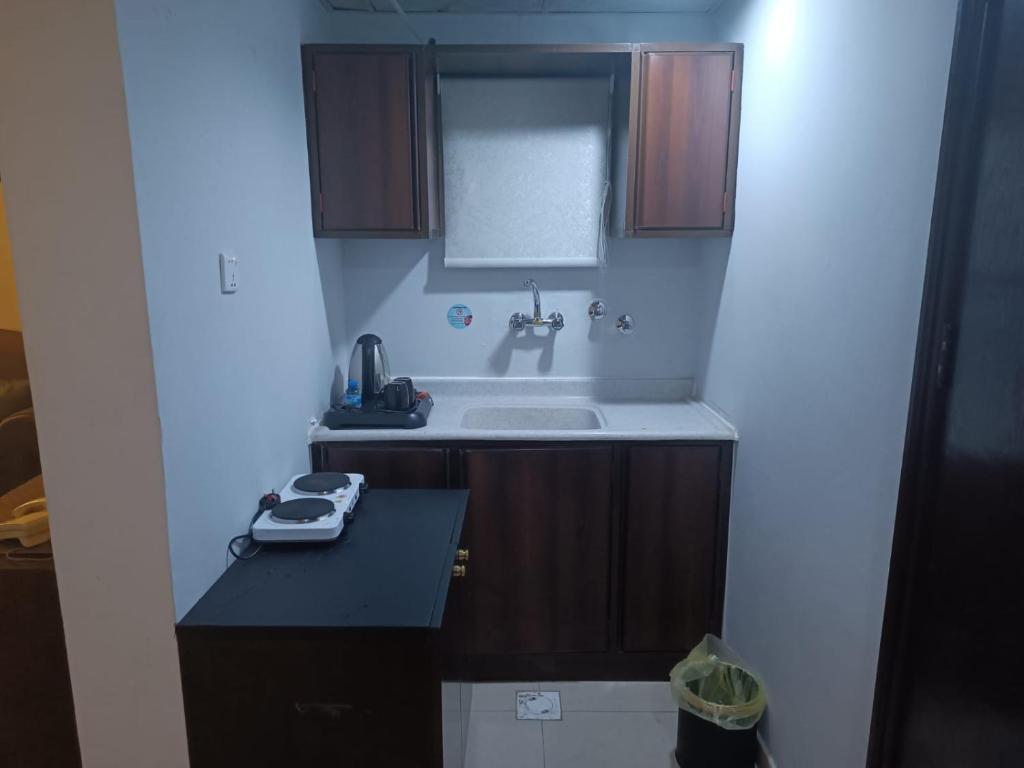 a bathroom with a sink and a bath tub at شقق الملتقي in Al Nairyah