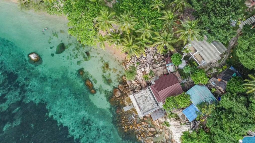 an aerial view of a resort on the ocean at P.D. Beach Resort in Koh Tao