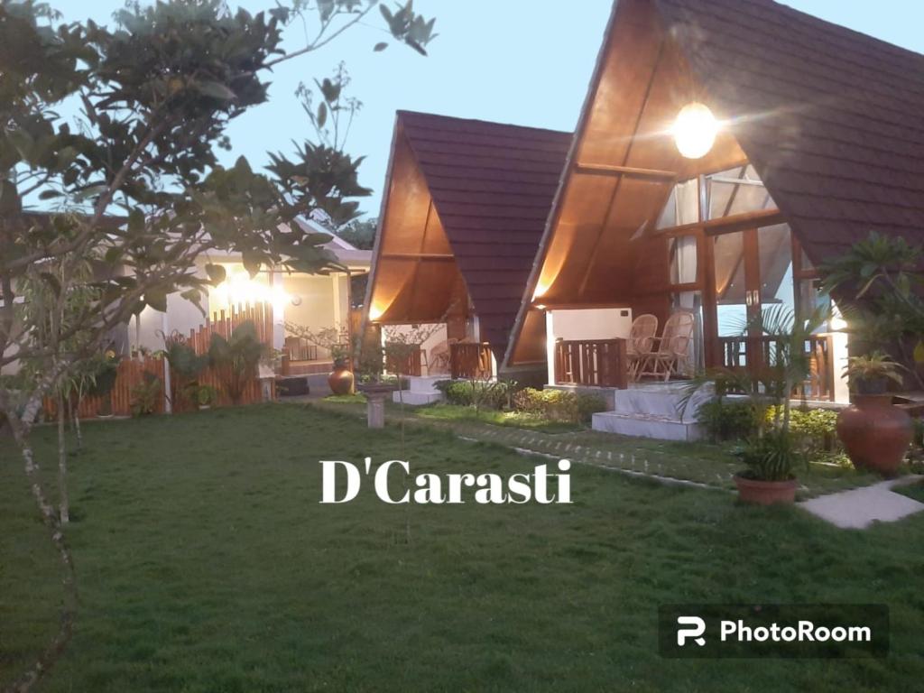 a house with a garden in front of it at D' Carasti Bungalow in Masbagik