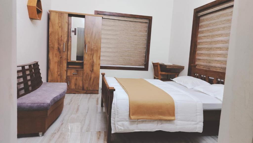 En eller flere senge i et værelse på UPPU HOMESTAY