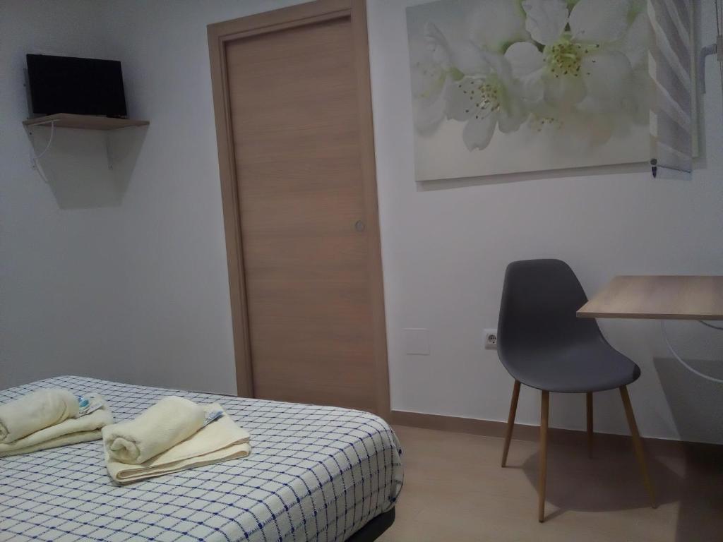 A bed or beds in a room at Casa María