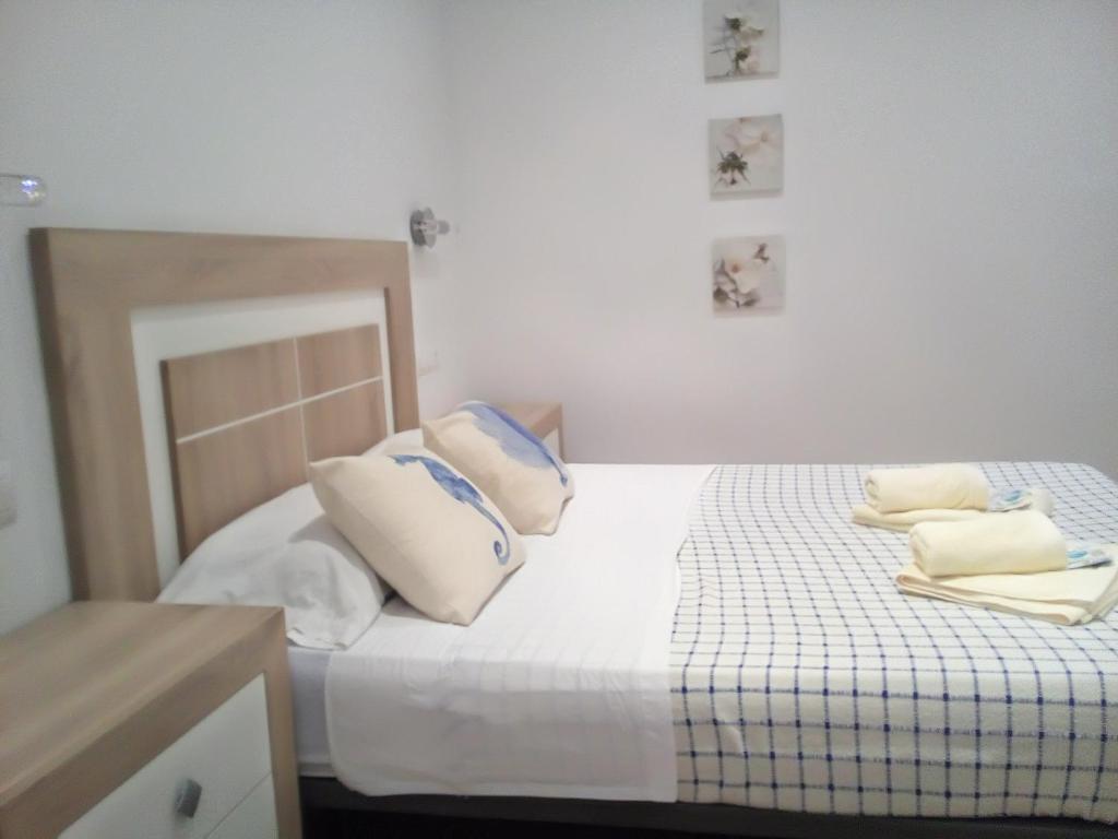 A bed or beds in a room at Casa María