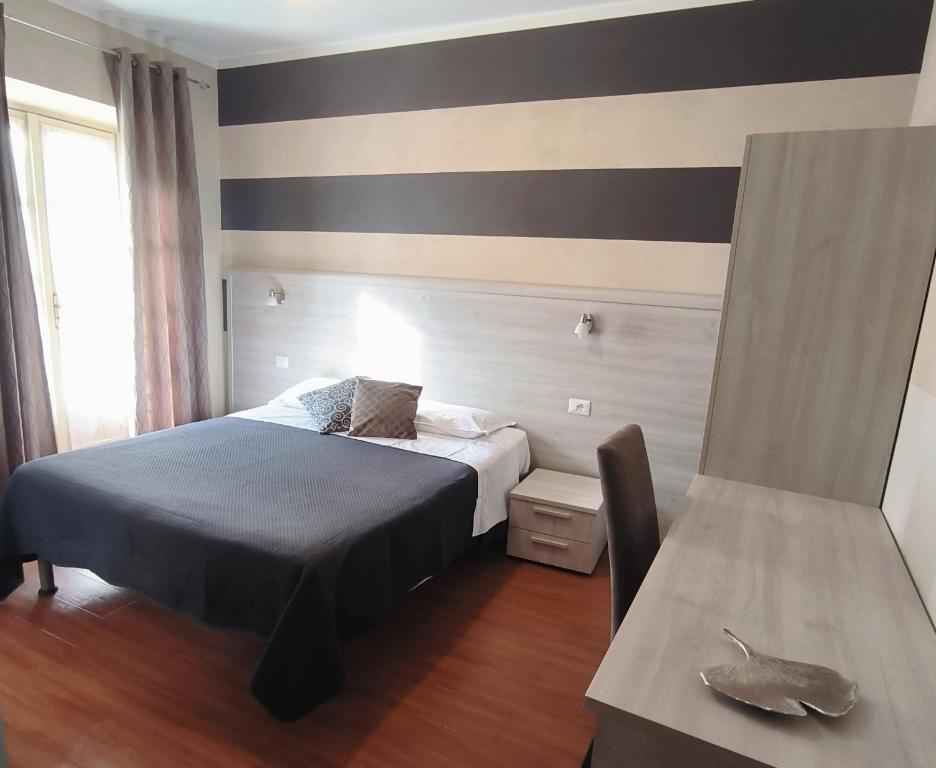 Postel nebo postele na pokoji v ubytování Nuovo Hotel Giardini