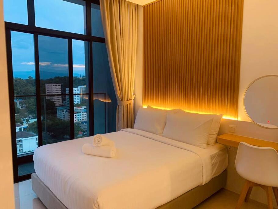 En eller flere senger på et rom på Apartment in Kota Kinabalu @ The Shore