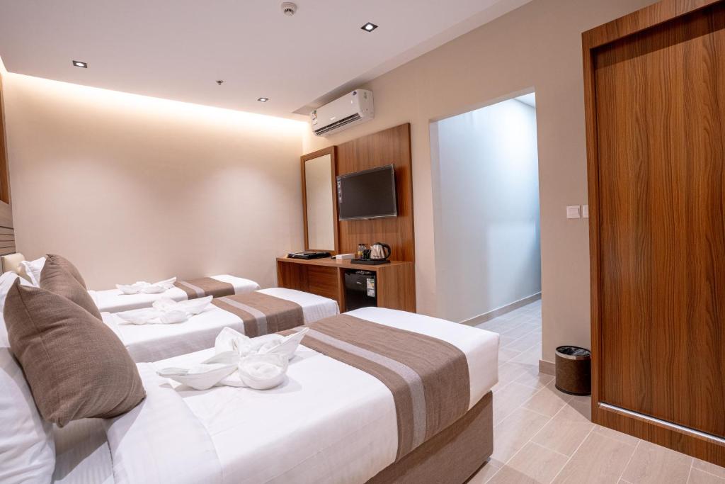 فندق كنانة العزيزية مكة: الخيار المثالي للعائلات والأزواج - الموقع المتميز والقرب من المعالم السياحية