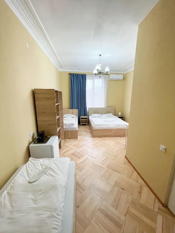 Postel nebo postele na pokoji v ubytování Guest House Top Floor