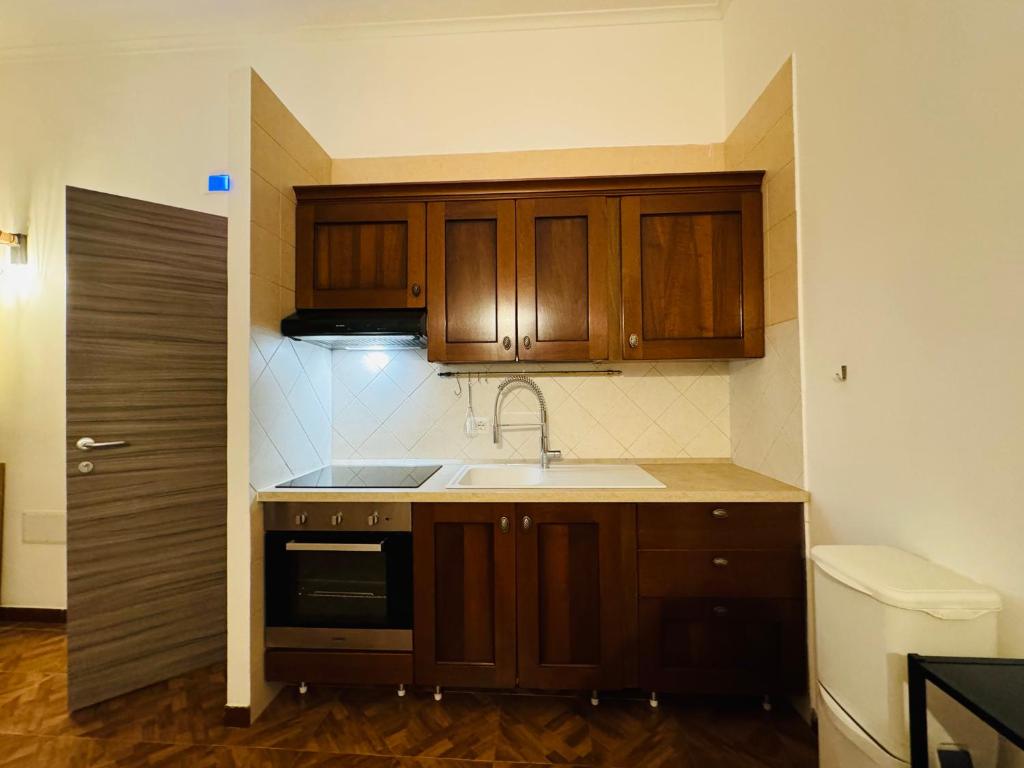 Kuchyň nebo kuchyňský kout v ubytování Hostel Mancini Naples