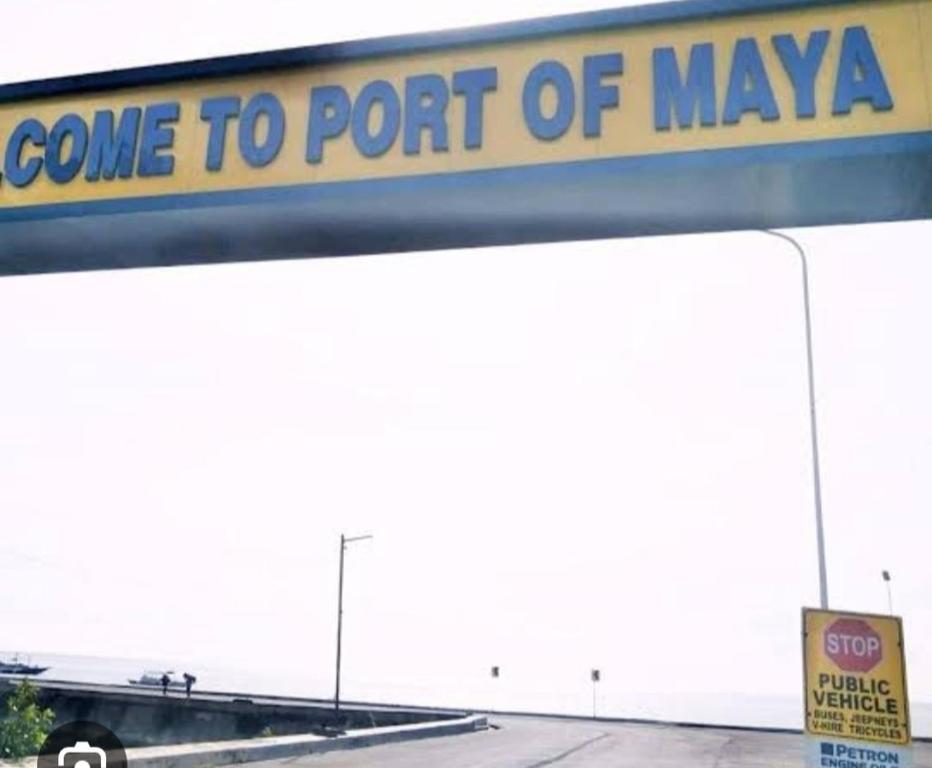 a sign that says come to port of maya at GmL Lodge House in Daanbantayan