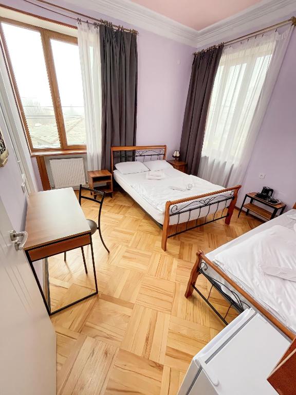 Postel nebo postele na pokoji v ubytování Guest House Top Floor