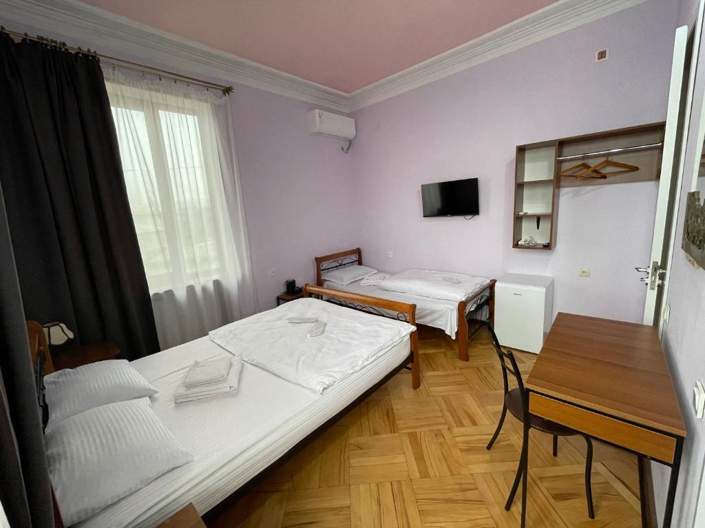 Postel nebo postele na pokoji v ubytování Guest House Top Floor