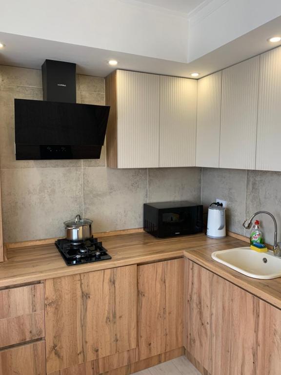 Køkken eller tekøkken på люкс квартира в центре города - все удобства - ждем Вас!