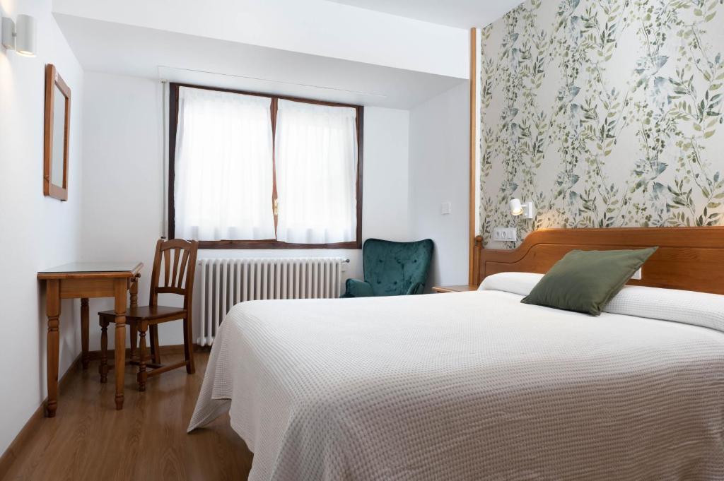 Postel nebo postele na pokoji v ubytování Hotel Mi Casa