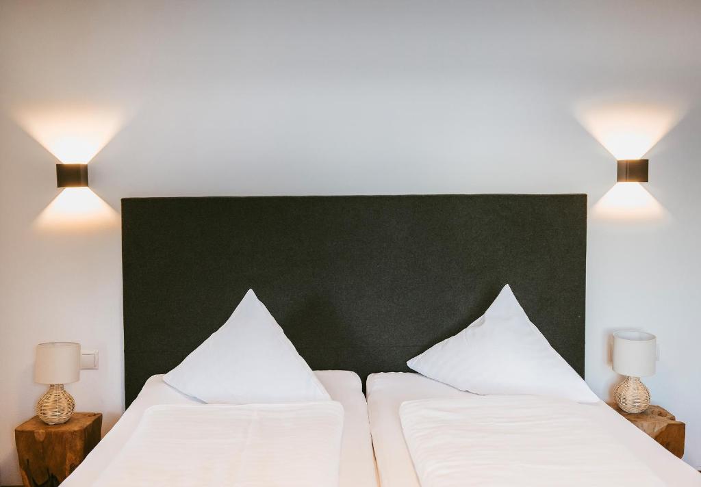 Postel nebo postele na pokoji v ubytování Hotel Gasthof Hirschentenne
