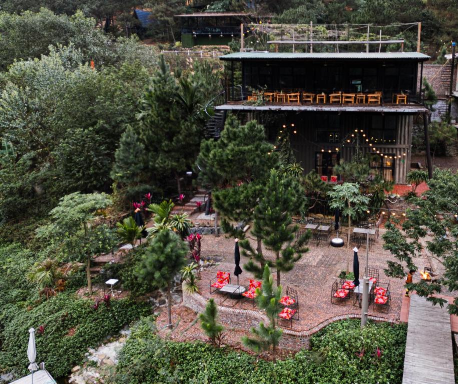 an aerial view of a garden with trees and a building at GISY Lake House in Sóc Sơn