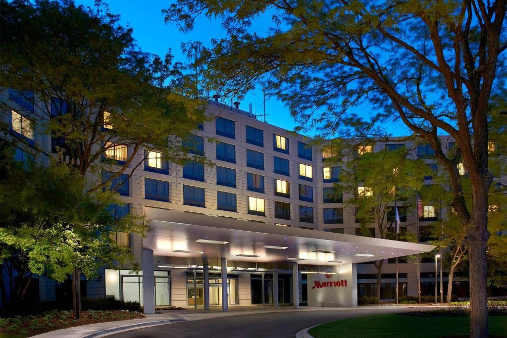 a rendering of the front of a building at night at Chicago Marriott Naperville in Naperville