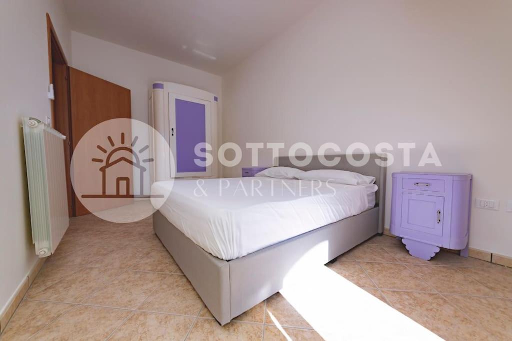 Postel nebo postele na pokoji v ubytování Purple Dreams - Marittima