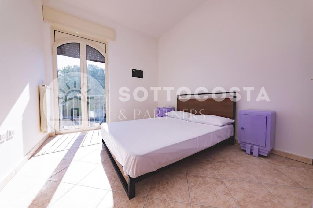 Postel nebo postele na pokoji v ubytování Purple Dreams - Marittima