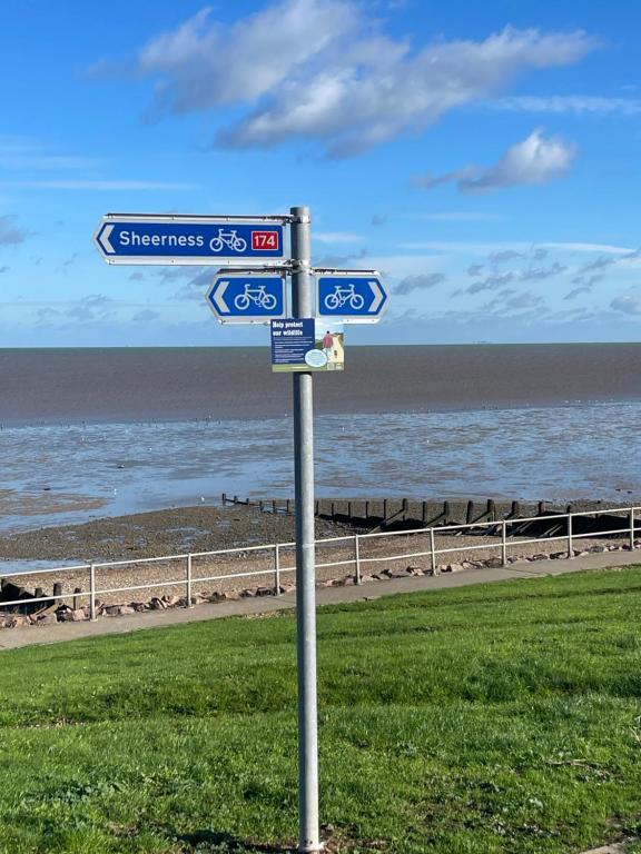 a street sign in front of the beach at Minster Leas in Sheerness