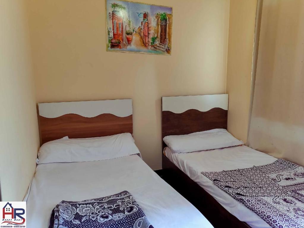 Кровать или кровати в номере Porto Matroh For Family