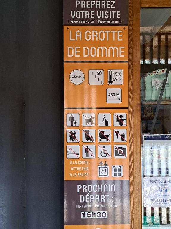 a sign in a store with some signs on it at Maison Domme Dordogne in Domme